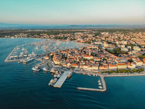 Biograd na Moru, marina aerial view, port with sailing boats and yachts in sunlight