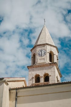 Ancient tower with vintage clock dial in Biograd na Moru of Croatia