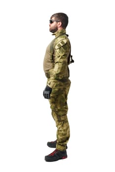 Full length portrait of man soldier wearing ammunition on white background