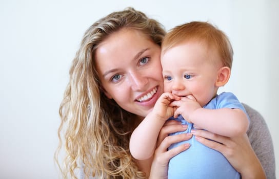Happy mother, portrait and hug with baby for love, embrace or care in trust or bonding together at home. Face of mom or little toddler with smile for family, childhood or motherhood in relax at house