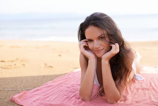 Relax, portrait or happy woman at beach for travel adventure or peace on holiday vacation in Bali. Tourist, picnic or female person on sand with blanket or smile in nature for fresh air, sea or ocean