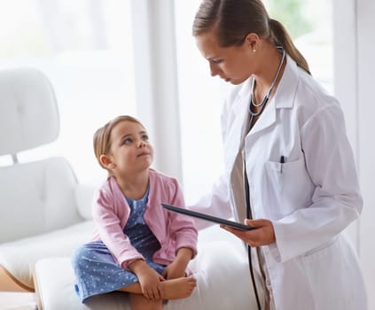 Pediatrician, child and tablet at pediatric hospital for health examination, wellness and support. Medical professional, kid patient and technology in clinic for healthcare, medicine and consult.