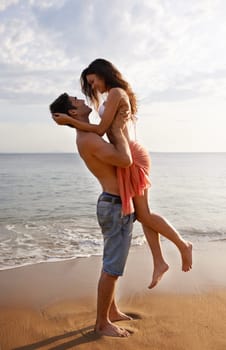 Love, waves and couple playing on beach for travel adventure, summer island holiday and relax. Ocean vacation, woman and man in nature on romantic date together with smile, embrace and sea in Bali