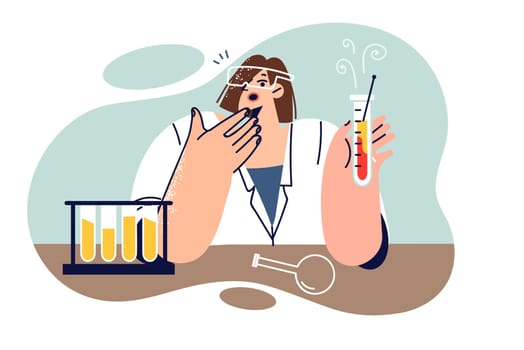 Woman chemist experiments with test tubes, sitting at laboratory table and making surprised grimace