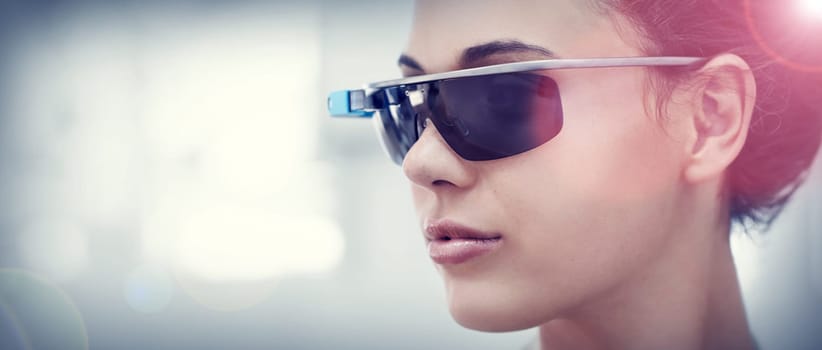 Augmented reality, future technology and woman with smart glasses, internet connection and mockup in office. Focus, workplace and consultant with VR sunglasses, vision and electronics for networking.