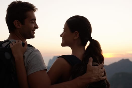 Hiking, hug or happy couple on holiday at sunset with smile for vacation memory, support or sightseeing. Love, tourism or romantic man with a woman for adventure or travel in Rio de Janeiro, Brazil.