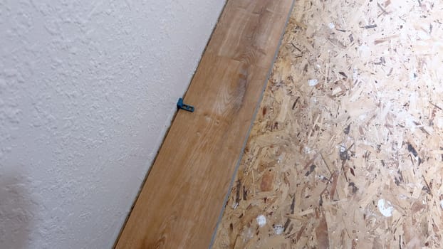 Precision in Progress: Installing a Vinyl Floorboard