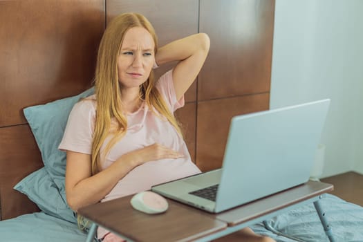 Weary pregnant woman, tired of working from home, navigates the challenges of balancing professional tasks with pregnancy demands