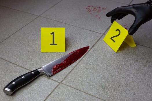 Evidence number near bloody knife at crime scene