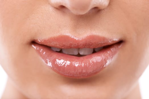 Closeup, mouth and shine with woman for beauty, makeup with gloss or oil for hydration and wellness. Lip care, cosmetics and teeth for dental health, treatment and moisturizing lips for dermatology.