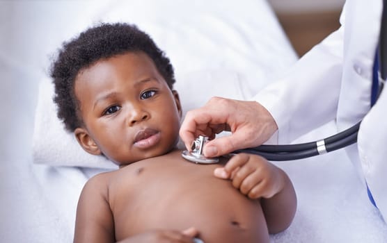 Baby, portrait and pediatrician with stethoscope consultation or lung infection or diagnosis, heartbeat or listening. Child, boy and face on hospital bed or healthcare checkup in Kenya, clinic or ill