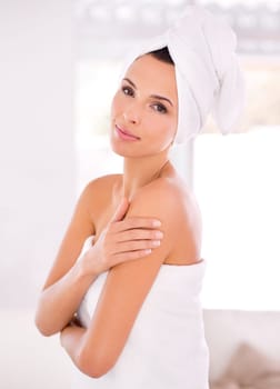 Bathroom, portrait and woman with smile for body care in morning with towel, aesthetic and dermatology. Girl, calm and happiness for shine, soft and smooth with skincare from results of treatment