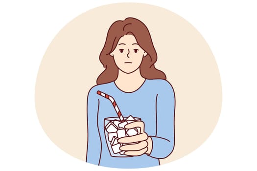 Emotionless girl holds glass full of sugar with straw symbolizing unhealthy nutrition