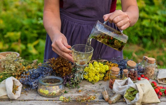 woman brews herbal tea. Selective focus.
