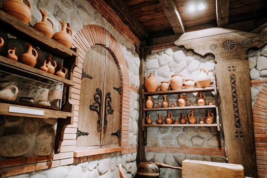 Traditional old wine cellar with handmade craft clay jugs.Antique winery concept