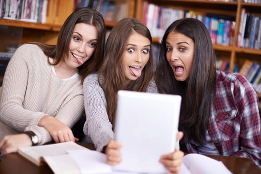 Women, students or tablet selfie on university campus or bonding together for crazy update on social media. Learners, touchscreen or post online as goofy friends or solidarity with care in library