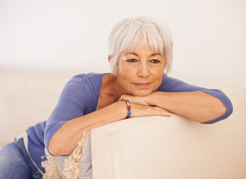 Mature woman, thinking and smile on couch, peace and memory to remember in living room. Happy female person, positive and planning for wellness in retirement, calm and daydreaming on mockup space