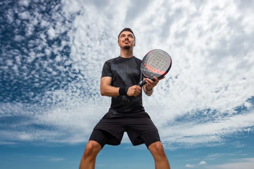 Padel tennis player on the sky background outdoors. Paddle tenis template for bookmaker design ads with copy space. Mockup for betting advertisement. Sports betting on tenis