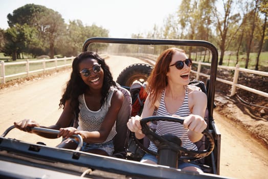 Happy women, laughing and vacation with road trip in nature and funny joke for adventure in outdoor. Friends, driving or journey in convertible van on holiday, countryside or bonding together by farm