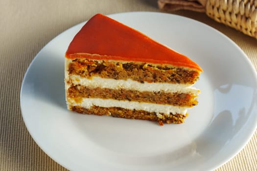 Deliciously Moist Carrot Cake Served on a Clean, White Plate