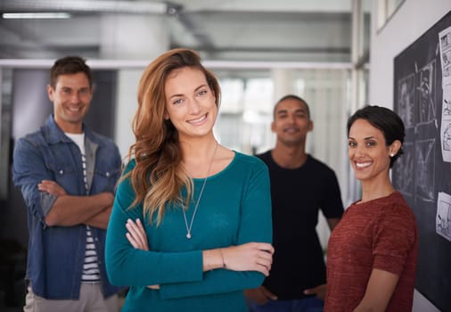 Businesswoman, smile and office portrait with colleagues, creative and professional career. Leadership, female person and confident with diversity coworkers in collaboration and standing together
