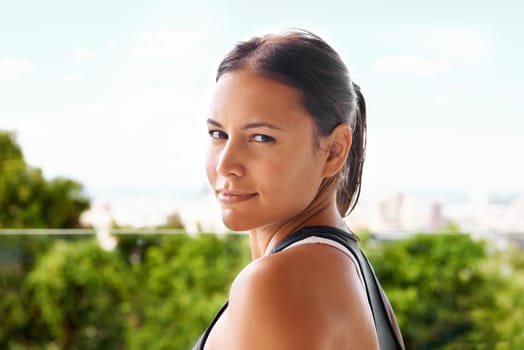 Portrait, fitness and woman outdoor for exercise, training or workout at balcony for wellness at garden. Face, sport and female person in nature for practice, wellbeing or health at park in Argentina.
