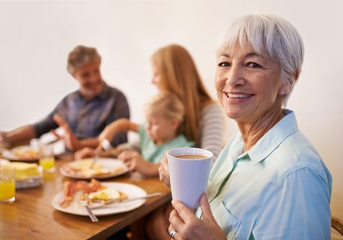 Grandmother, family and smile for breakfast with happiness in morning for bonding with conversation, support and care. Portrait, senior woman and meal to eat with coffee at table, enjoy and together.