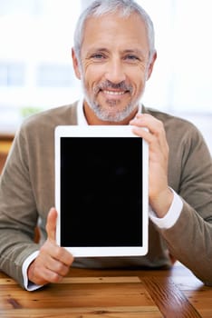 Portrait, tablet screen and happy man or manager showing mockup space at desk in office for marketing business. Face, display and person with technology for advertising or promo of mature consultant