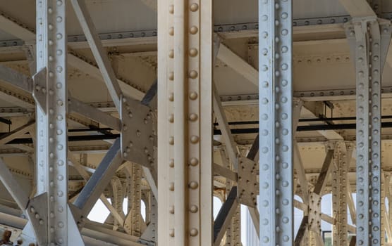 Detail of Structure and ironwork supporting underneath Southwark Bridge.