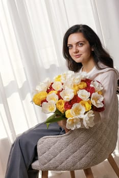 woman in the white shirt with flowers tulips