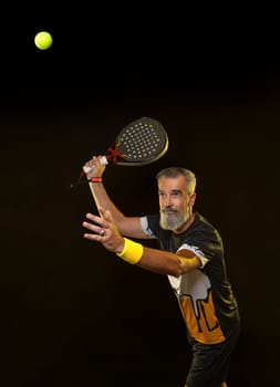 Padel tennis player with racket. Man athlete with paddle tenis racket. Sport concept. Download a high quality photo for the design of a sports application