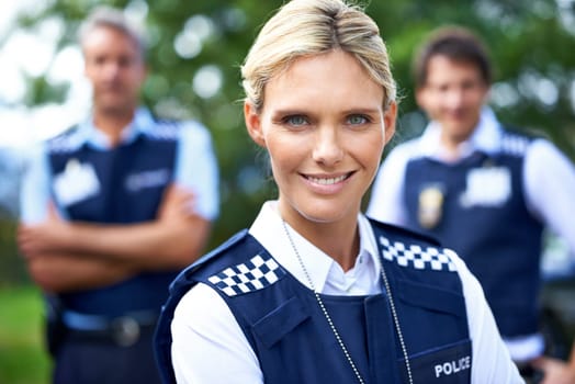 Security, law enforcement and portrait of police woman outdoors for crime, protection and safety service. Teamwork, collaboration and officer with confidence for patrol, justice and surveillance