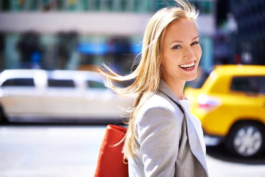 Woman, portrait and smile with city, walk and commute for work or career. Designer, job and new york street with urban, summer and happiness with confident and creative business travel in downtown