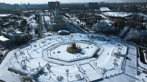 Top view of round square in winter. Creative. Beautiful historical square with fountain on sunny winter day. Sovetskaya Square with architecture and square in city center