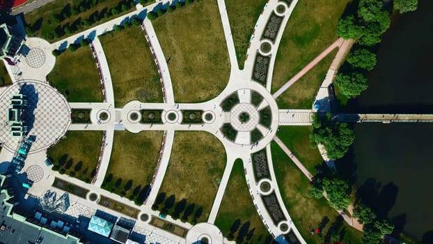 Landscaped geometric garden. Creative. Top view of geometric trails with pattern. People walk in historical park with geometric landscape