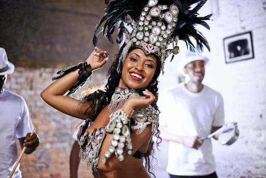 Portrait, happy woman and dancer at carnival for performance with band at party for celebration. Face, samba or Brazilian person at music festival in feather costume, makeup or smile at concert event