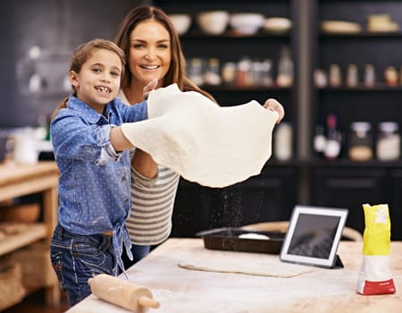 Portrait, mother or child baking pizza in a kitchen teaching recipe for help, support or learning in home. Kid, tablet or girl cooking with parent, family and mom for dinner, supper or lunch together.