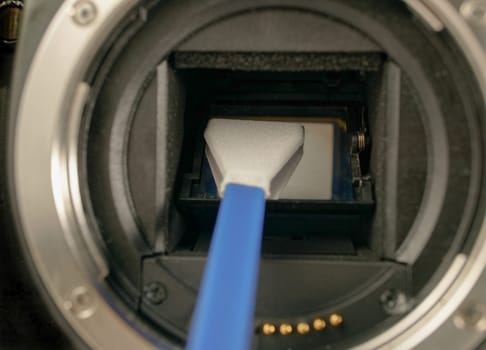 close-up of the cleaning of a reflex camera sensor
