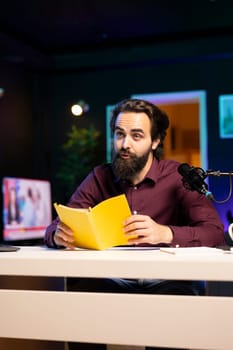 Content creator does influencer marketing, doing new author novel product placement in studio