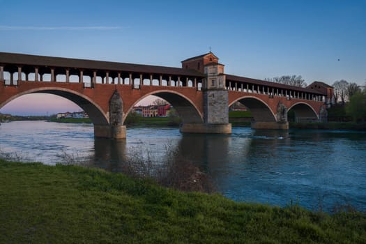wonderful view of Ponte Coperto Pavia (covered bridge) at blue hour