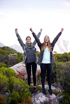 Woman, friends and portrait for hiking celebration on mountain for exercise training, trekking or environment. Female people, face and arms up for nature workout with cardio, happiness or journey
