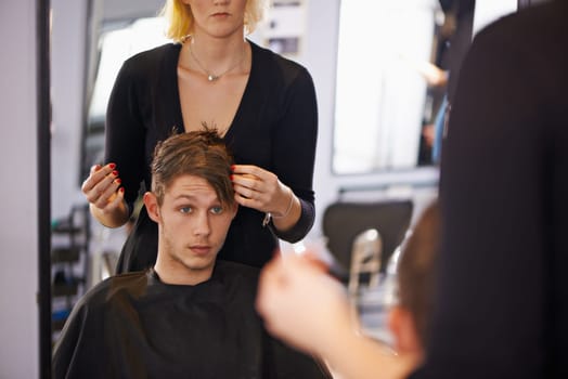 Customer, styling and man in mirror with hairdresser for professional haircare, cut or luxury treatment. Grooming, hair and client at salon for care, unique haircut and small business with service