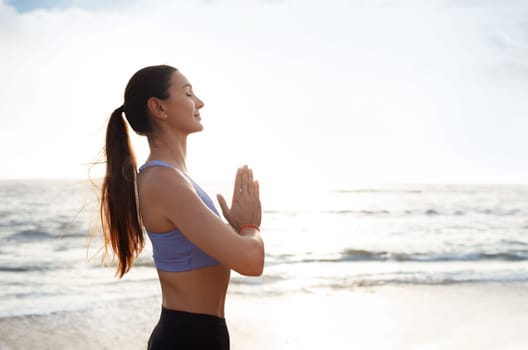 Calm glad young caucasian woman enjoy morning workout alone, silence, calm and breathing exercises
