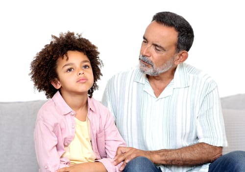 Grandpa Talking To Depressed Little Grandson While Boy Sulking Indoor