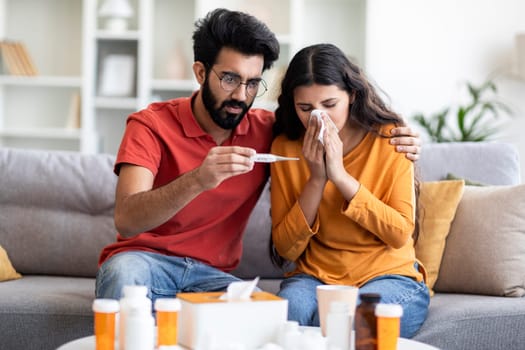 Worried Indian Man Taking Care Of His Ill Wife At Home
