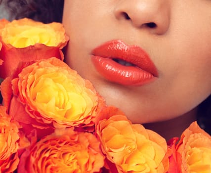 Lips, macro and woman with flowers, plants and bouquet for fragrance, scent and makeup for sustainable cosmetics. Girl, rose and mouth for beauty with eco friendly, floral and organic skin care
