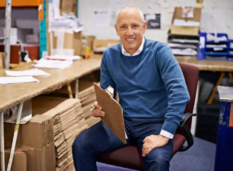 Portrait, business or old man with clipboard in warehouse office for logistics, planning or cargo checklist. Industry, supply chain or factory manager with compliance documents for cardboard recycle