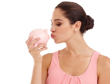 Kiss, piggy bank and woman in studio for budget, finance or investment safety. Face, container or person with money box for savings, income or security of future profit isolated on a white background