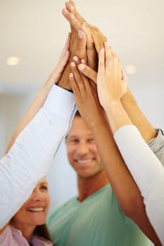 Closeup, business people and smile with high five in meeting for team building, partnership and support. Diversity, employees and hands with celebration for motivation, success and collaboration.