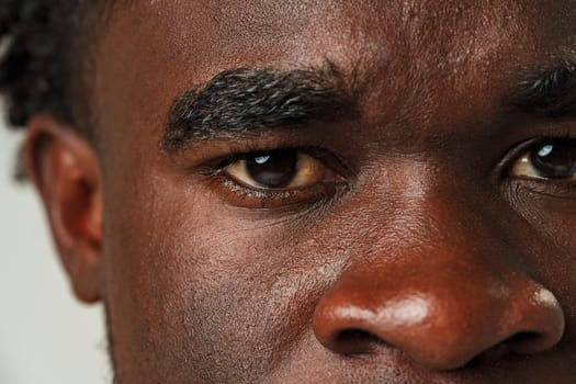 Close Up of African Mans Face With Brown Eyes